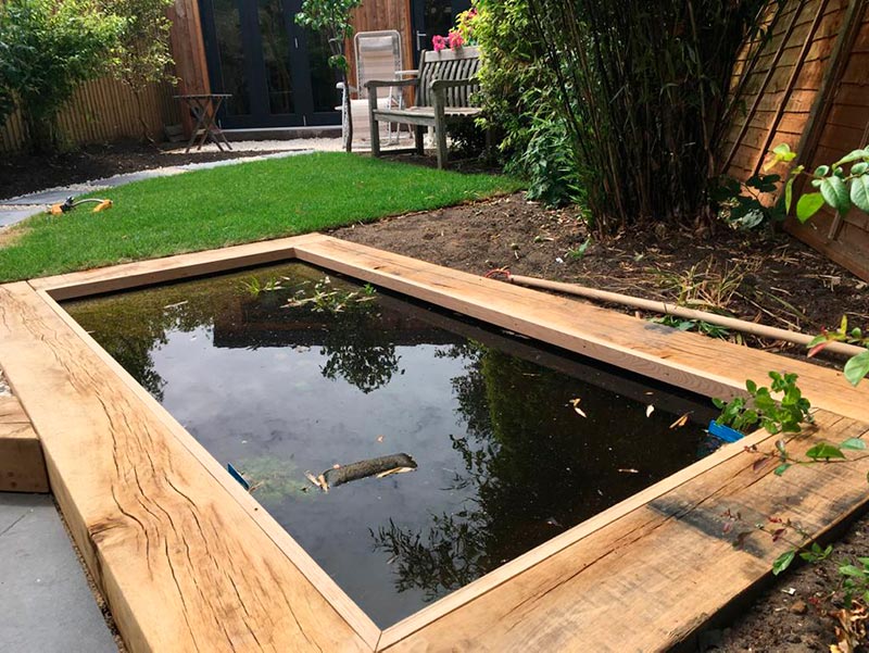 bespoke pond with sleeper edging | Landscaping Monmouthshire