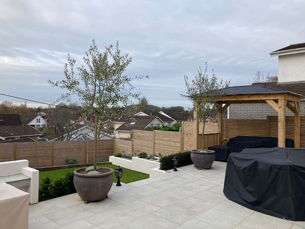 porcelain patio, rendered raised planters and bespoke pergola | Landscaping Monmouthshire